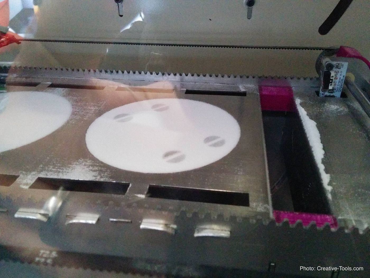 SLS printer powder bed after a build layer.