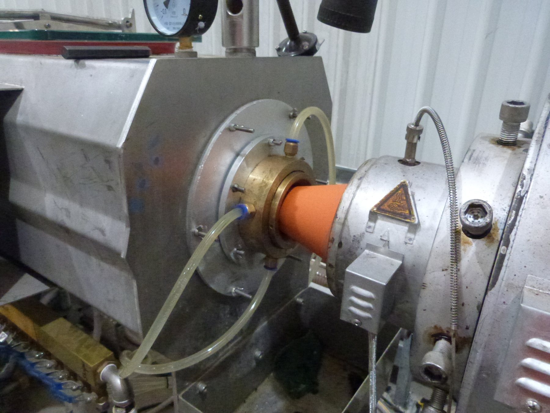 HDPE pipe leaving the extrusion die.