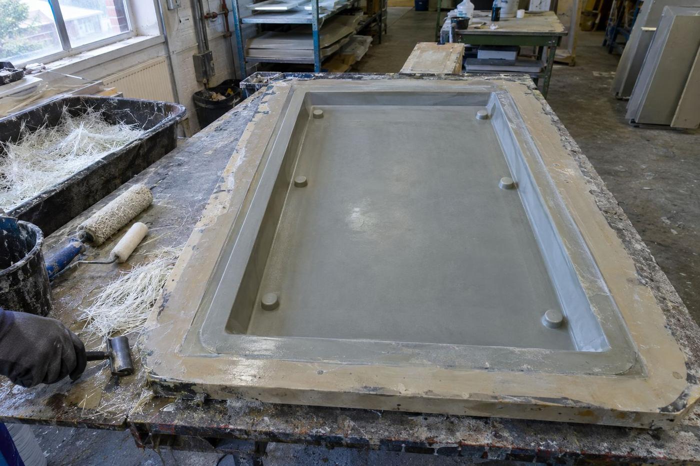 Overhead view of GRC panel face mould with returns and tools.